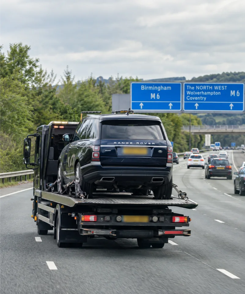 Tow Truck Carrying Range Rover on UK Motorway